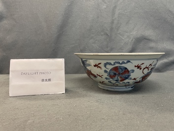 A Chinese blue, white and copper red bowl with Buddhist lions, Qianlong mark, 19th C.