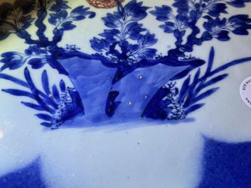 A Chinese blue, white and copper red powder blue-ground charger, Kangxi