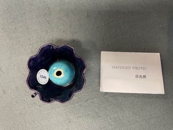 A Chinese aubergine- and turquoise-glazed 'lotus' trick cup, Kangxi