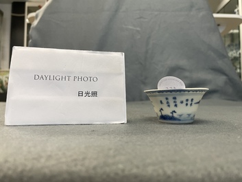 A Chinese blue and white inscribed wine cup, Kangxi