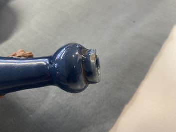 A Chinese monochrome blue garlic head vase with applied biscuit dragon, Jiajing