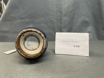 A Chinese monochrome blue garlic head vase with applied biscuit dragon, Jiajing
