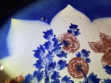 A Chinese blue, white and copper red powder blue-ground charger, Kangxi