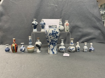 Fifteen Chinese mostly blue and white miniature vases, Kangxi
