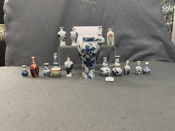 Fifteen Chinese mostly blue and white miniature vases, Kangxi