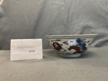 A Chinese blue, white and copper red bowl with Buddhist lions, Qianlong mark, 19th C.