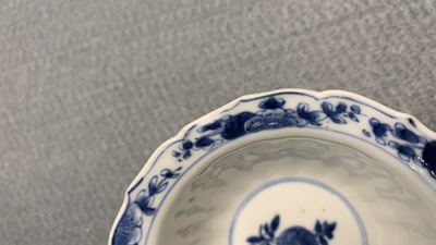 Eleven Chinese blue and white lobed cups and saucers, Kangxi