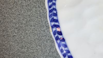 Seventeen Chinese blue and white cups and twenty-two saucers with floral design, Kangxi