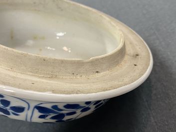 A pair of Chinese blue and white 'hunting scene' jars and covers, Kangxi