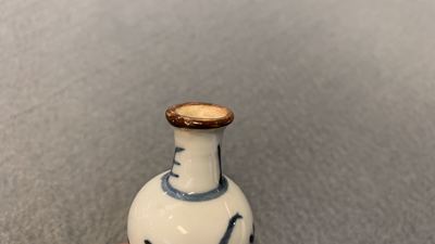 Fifteen Chinese mostly blue and white miniature vases, Kangxi