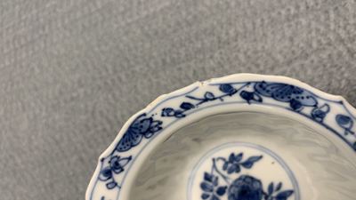 Eleven Chinese blue and white lobed cups and saucers, Kangxi