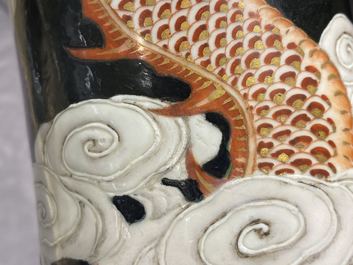 A Chinese famille noire 'dragon' bottle vase, 19th C.