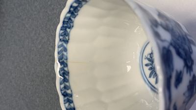 Seventeen Chinese blue and white cups and twenty-two saucers with floral design, Kangxi