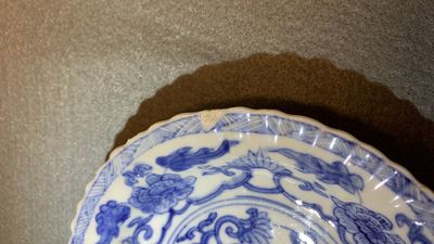 Seventeen Chinese blue and white cups and twenty-two saucers with floral design, Kangxi