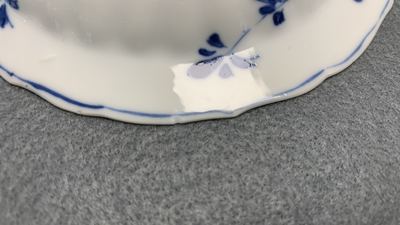 Eleven Chinese blue and white lobed cups and saucers, Kangxi