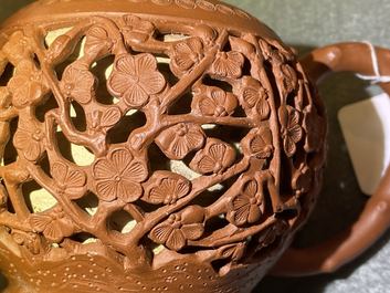 A Chinese reticulated Yixing stoneware teapot and cover, Kangxi