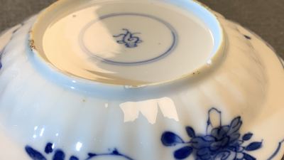 Eleven Chinese blue and white lobed cups and saucers, Kangxi