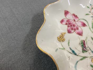 A Chinese famille rose 'lotus' cup and saucer with applied design, Yongzheng