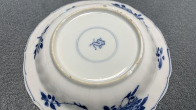 Eleven Chinese blue and white lobed cups and saucers, Kangxi