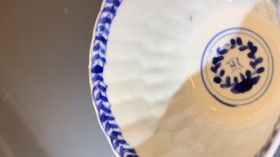 Seventeen Chinese blue and white cups and twenty-two saucers with floral design, Kangxi