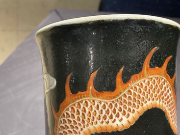 A Chinese famille noire 'dragon' bottle vase, 19th C.