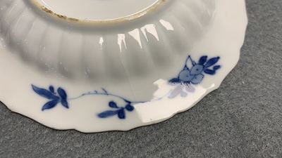 Eleven Chinese blue and white lobed cups and saucers, Kangxi