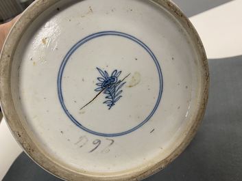 A pair of Chinese blue and white 'hunting scene' jars and covers, Kangxi