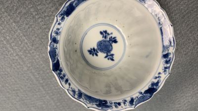 Eleven Chinese blue and white lobed cups and saucers, Kangxi