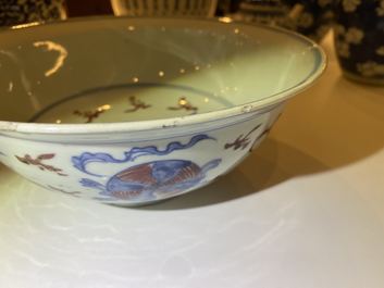 A Chinese blue, white and copper red bowl with Buddhist lions, Qianlong mark, 19th C.