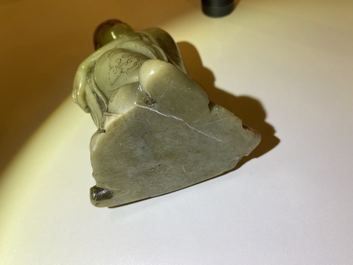 A Chinese Shoushan soapstone figure of a seated man, 18/19th C.