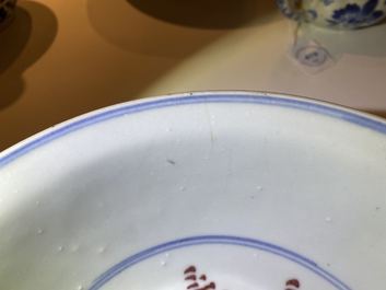 A Chinese blue, white and copper red bowl with Buddhist lions, Qianlong mark, 19th C.