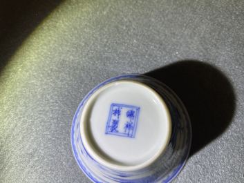 A Chinese blue and white inscribed wine cup, Kangxi