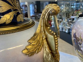 A pair of massive French S&egrave;vres-style vases with gilt bronze mounts, signed Desprez, 19th C.