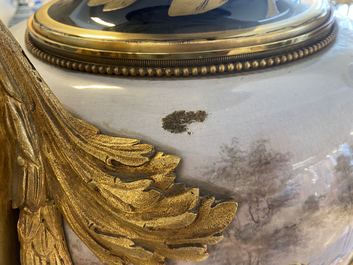 A pair of massive French S&egrave;vres-style vases with gilt bronze mounts, signed Desprez, 19th C.