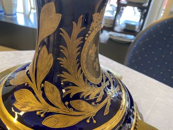 A pair of massive French S&egrave;vres-style vases with gilt bronze mounts, signed Desprez, 19th C.