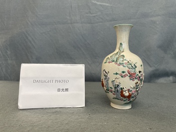 A Chinese famille rose relief-molded 'immortals' vase, Qianlong mark, 19th C.