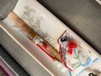 A pair of Chinese polychrome carved wrist rests in presentation box, Republic
