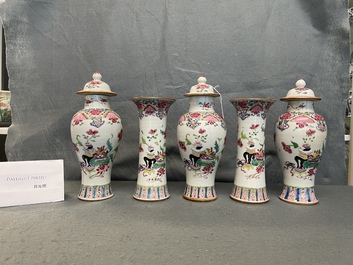 A Chinese famille rose garniture of five vases with antiquities, Qianlong