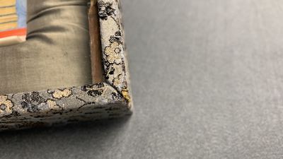 A pair of Chinese polychrome carved wrist rests in presentation box, Republic