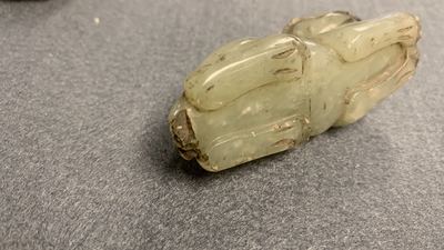 Five Chinese celadon and russet jade carvings, 19th C.