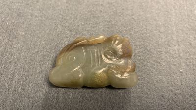 Five Chinese celadon and russet jade carvings, 19th C.