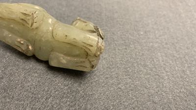 Five Chinese celadon and russet jade carvings, 19th C.