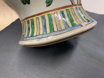 A pair of Chinese famille verte 'dragon' vases and covers, 19th C.
