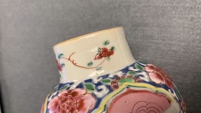A Chinese famille rose garniture of five vases with antiquities, Qianlong
