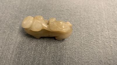 Five Chinese celadon and russet jade carvings, 19th C.