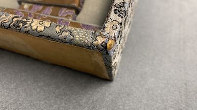 A pair of Chinese polychrome carved wrist rests in presentation box, Republic