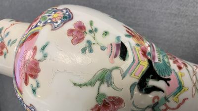 A Chinese famille rose garniture of five vases with antiquities, Qianlong