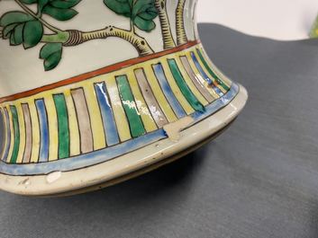 A pair of Chinese famille verte 'dragon' vases and covers, 19th C.