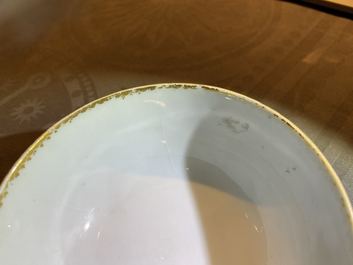 Four Chinese gilt-decorated blue-ground cups and saucers with fine landscapes, Qianlong