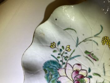 Een Chinese famille rose lotusvormige kop en schotel met reli&euml;fdecor, Yongzheng